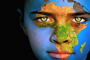 Portrait of a boy with the map of the world painted on his face